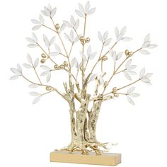 a gold and white tree sculpture on a wooden base