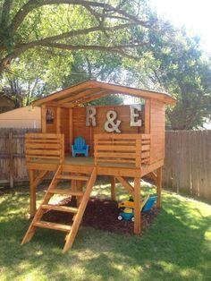 an image of a wooden play structure with the word love on it's side