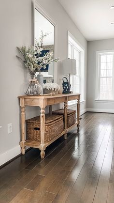 a wooden table sitting on top of a hard wood floor