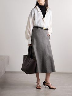 Brunello Cucinelli's midi skirt is tailored from wool-felt that holds a nice shape. Partially lined in satin for smoothness and comfort, it has a subtle, elongating front seam and belt loops at the high waist. Wear yours with the coordinating jacket for a cohesive look. Chic Flowy Wool Skirt, Chic Wool Flared Skirt, Classic Long Skirt For Formal Occasions, Classic Formal Long Skirt, Elegant Tailored Flared Skirt, Office Wool Flared Skirt, Wool Pleated Office Skirt, Tailored Long Skirt For Work, Elegant Full Skirt For Office