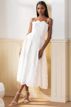 FINAL SALE! NO RETURNS. NO EXCHANGES. A chic midi white rose eyelet dress with detachable straps, featuring invisible zippers and convenient pockets. Perfect for effortless vacation getaway style! LENGTH: Top of shoulder to hem 41" FABRICATION: 100% COTTON STYLE#.DR-21329 CAPRI EYELET-CAPRI-S24 *Dry Clean or wash on cold and hang flat to dry *Model is wearing size XS White Ankle Length Dress, Old Money Rehearsal Dinner Dress, Lace Rehearsal Dinner Dress, Off The Shoulder White Dress, Feminine White Midi Dress With Ruffle Hem, Green And White Dress, White Wedding Guest Dress, Bride Rehearsal Dinner Dress, White Scalloped Lace Mini Dress For Garden Party