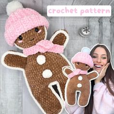 a woman is holding up a crocheted teddy bear with a pink hat on