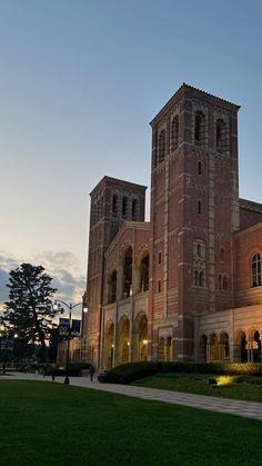 a large building with two towers on top of it's sides at night time