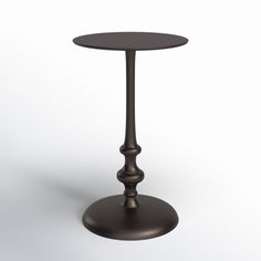 a small round table with a metal base and an iron top on a white background