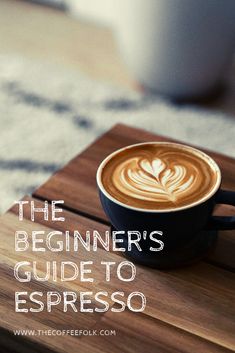 the beginner's guide to espresso is shown on a wooden table