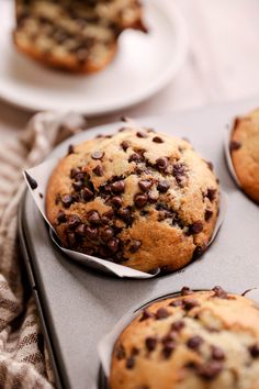 chocolate chip muffins sitting on top of a pan