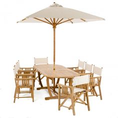 a wooden table with chairs and an umbrella