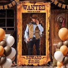 an old west wanted poster with balloons and streamers in front of the photo frame