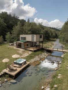 an outdoor hot tub in the middle of a river next to a wooden deck with chairs and umbrellas