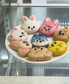 a white plate topped with lots of different types of cookies