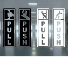 an airport lobby door with several signs on the glass that say push, pull and lift