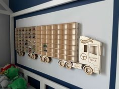 a toy truck mounted to the side of a wall in a child's bedroom