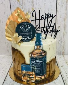 a birthday cake with a bottle of jack daniels on it