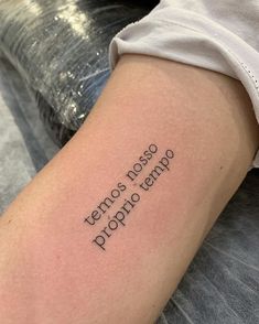 a woman's arm with the words temporary tattoo on it, and an inscription that reads