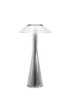 a silver table lamp with a white shade on it's top and bottom part