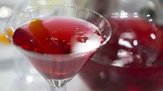 a close up of a drink in a glass on a table