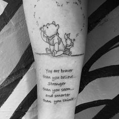 a winnie the pooh tattoo on the leg with an inspirational quote below it that reads, you are braver than you believe