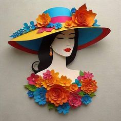 a woman's hat with flowers on it is made out of paper and cardboard