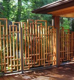 a wooden fence is shown in front of some trees