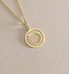 14K Real Solid Gold Ouroboros gold necklace ● Material of pendant: Solid Gold 14k ( REAL GOLD ) ● Metal Stamp: 14L ( REAL GOLD ) ● The pendant is available in 6 sizes: - 14,0 mm / 0,55 inches ( Diameter ) In the photos - 15,3 mm / 0.60 inches ( Diameter ) - 16,5 mm / 0,65 inches ( Diameter ) - 19,1 mm / 0,75 inches ( Diameter ) - 21 mm / 0,82 inches ( Diameter ) - 23 mm / 0.90 inches ( Diameter ) ( In the photos the size is 14mm / 0.55 inches Diameter ) ( Jump Ring inner diameter: 4 mm ) ● Mater Snake Pendant, Cycle Of Life, Snake Jewelry, Ancient Symbols, Gold Charm, Jump Rings, Metal Stamping, Gold Style, Real Gold