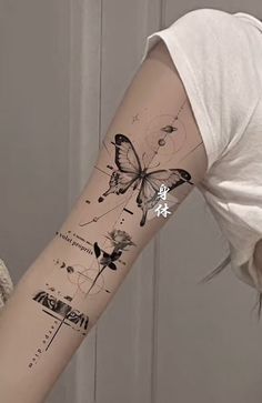 a woman with a butterfly tattoo on her arm