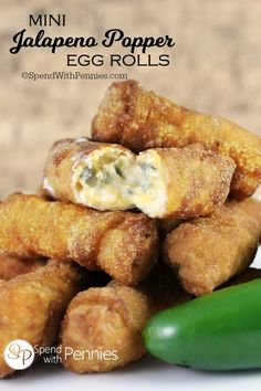 egg rolls stacked on top of each other with text overlay that reads jalapeno popper egg rolls