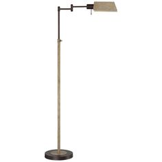 a floor lamp with a white shade on it's head and a black base