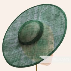 *This is not a fitted hat! You will need to attach a headband, comb or elastic to secure it to your head* This bottle green cartwheel hat base is a classic shape that has sprung into popularity in the past year. Made from 2 layers of stiffened sinamay, these cartwheels are ready to trim and are fitted with a petersham ribbon on the inside crown edge. Simply add a comb or headband to secure to the head. Hat base measures: Width: 35.5cm (14 inches) Crown Width: 13.5cm (5.3 inches) Crown Height: Approximately 3.5cm (1.7 inches) In this listing we give you the option of attaching an elastic, this is to help secure the fascinator base to your head as it is not a fitted/finished headpiece. If you would prefer to use a headband or a comb, these can be purchased separately in our shop for you to s Green Straw Hat With Curved Brim For Garden Party, Green Curved Brim Straw Hat For Garden Party, Green Brimmed Straw Hat For Garden Party, Adjustable Green Costume Hats With Short Brim, Green Wide Brim Straw Hat For Garden Party, Green Straw Hat With Curved Brim For Spring, Green Curved Brim Straw Hat For Spring, Green Boater Hat With Flat Brim For Summer, Green Summer Boater Hat With Flat Brim