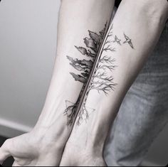 two people with matching tattoos on their arms