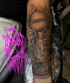 a man with a tattoo on his arm holding a basketball in front of the word world's cup