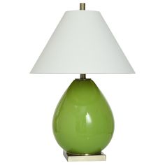 a green table lamp with a white shade