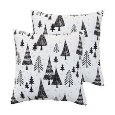 two black and white pillows with trees on them