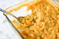 a glass casserole dish filled with macaroni and cheese