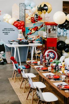 the table is set up for a birthday party