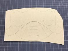 a piece of paper cut out to look like a face