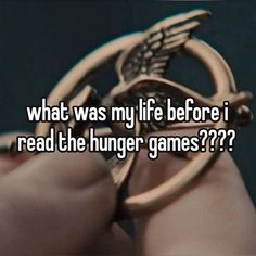 someone holding a ring with the words what was my life before i read the hunger games?