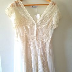 Simply Gorgeous Zara Dress. Fabric: 100% Polyamide (Dress), 100% Cotton (Broderoes), And 100% Polyester (Lining). 17 Inches Across The Chest, 46 Inches Long. Eur And Usa Size L. Color: Off White/Light Creme. Brand New With Tags. Bought In Europe. Simple White Boho Dress, Vintage Engagement Dress, Simple Boho Wedding Dress Casual, Elegant White Embroidered Dress By Zara, Zara Beige Bohemian Dress, White Embroidered Zara Dress, White Zara Dress With Lace Trim, Zara White Long Sleeve Embroidered Dress, Printed Green Dress