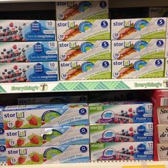 toothpaste is displayed on shelves in a store