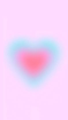 a blurry image of a pink heart with blue and red highlights on the bottom