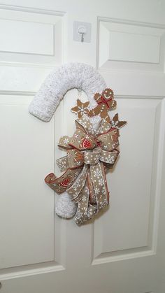 a white door with a christmas decoration on it