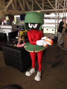 a person in a costume holding a plate