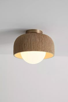 a ceiling light with rope wrapped around it