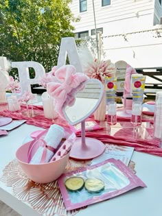 a table topped with lots of pink items