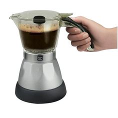 a person is using a blender to make coffee