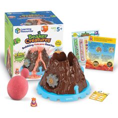 an image of a play set with toys and materials for making the volcano rock model