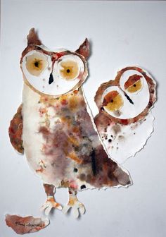 an owl and its baby are made out of torn paper