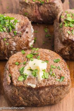 baked meatloaf with butter and herbs on a cutting board