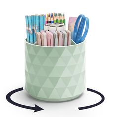 a pen holder filled with pens and pencils