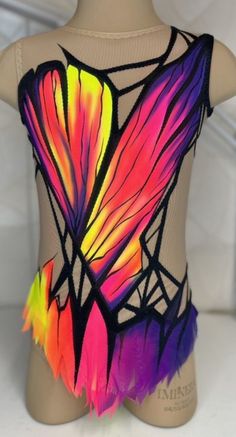 a woman's leotard with multicolored feathers on it