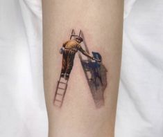 a man is painting on the side of his leg with a paintbrush and ladder